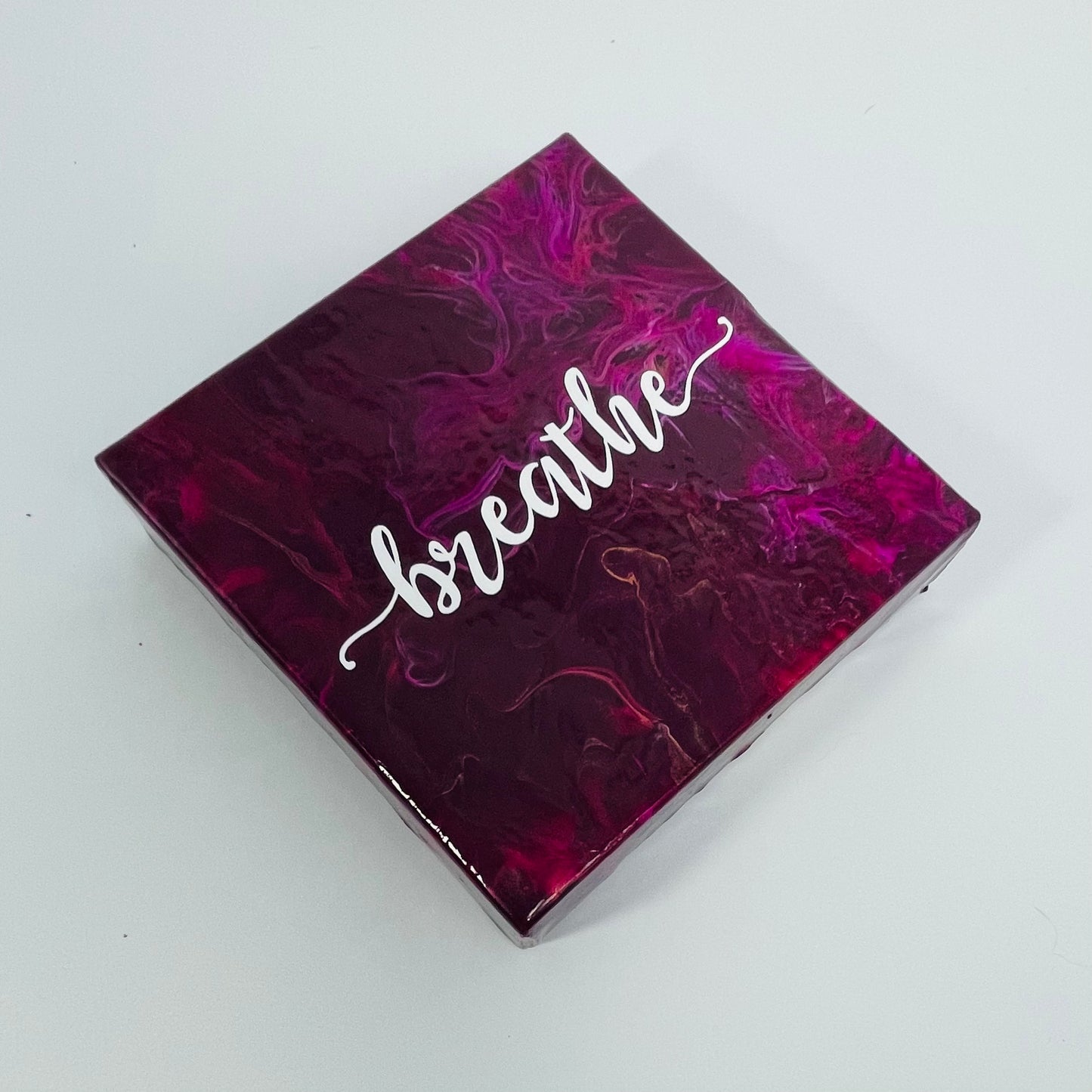 The Lotus Breathe Block. A colorful hand painted painting that says 'breathe'