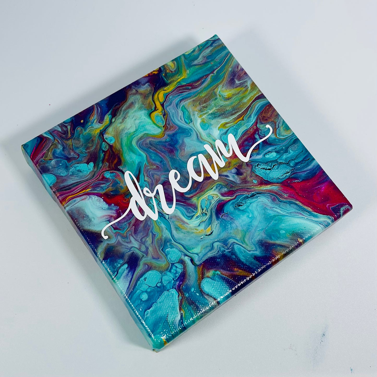 The Ambition Dream Block. A colorful hand painted painting that says 'Dream'