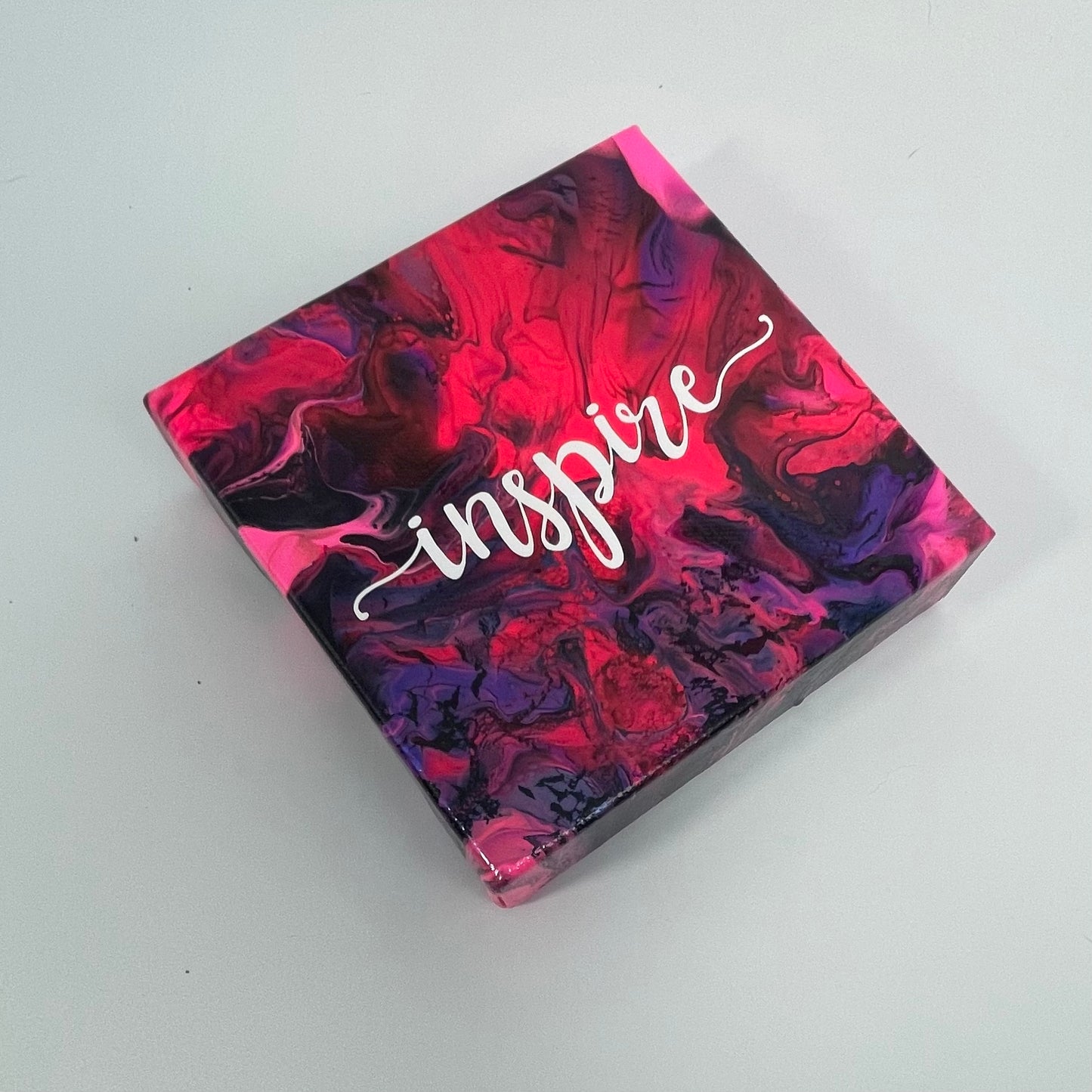 The Lark Inspire Block. A colorful hand painted painting that says 'Inpire'