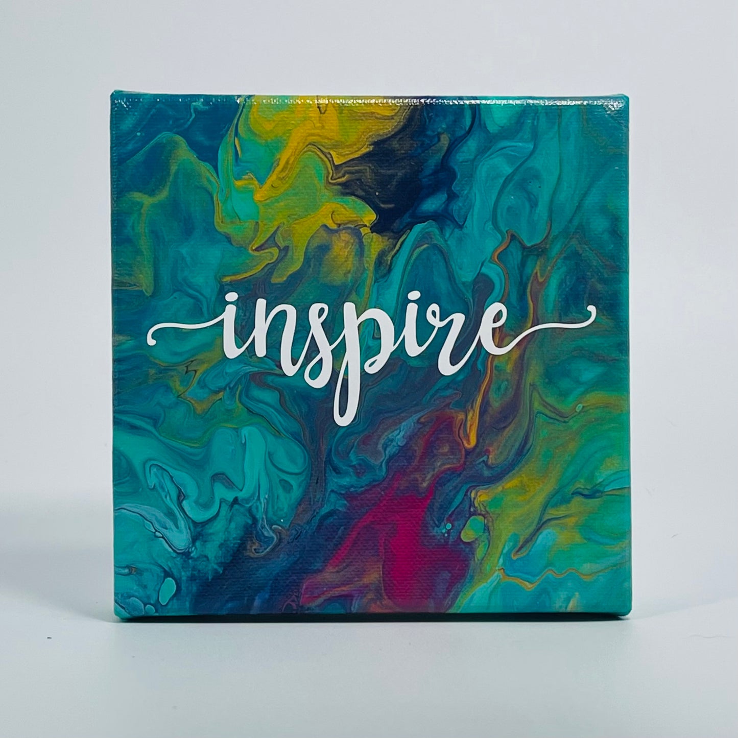The Pierce Inspire Block. A colorful hand painted painting that says 'Inpire'