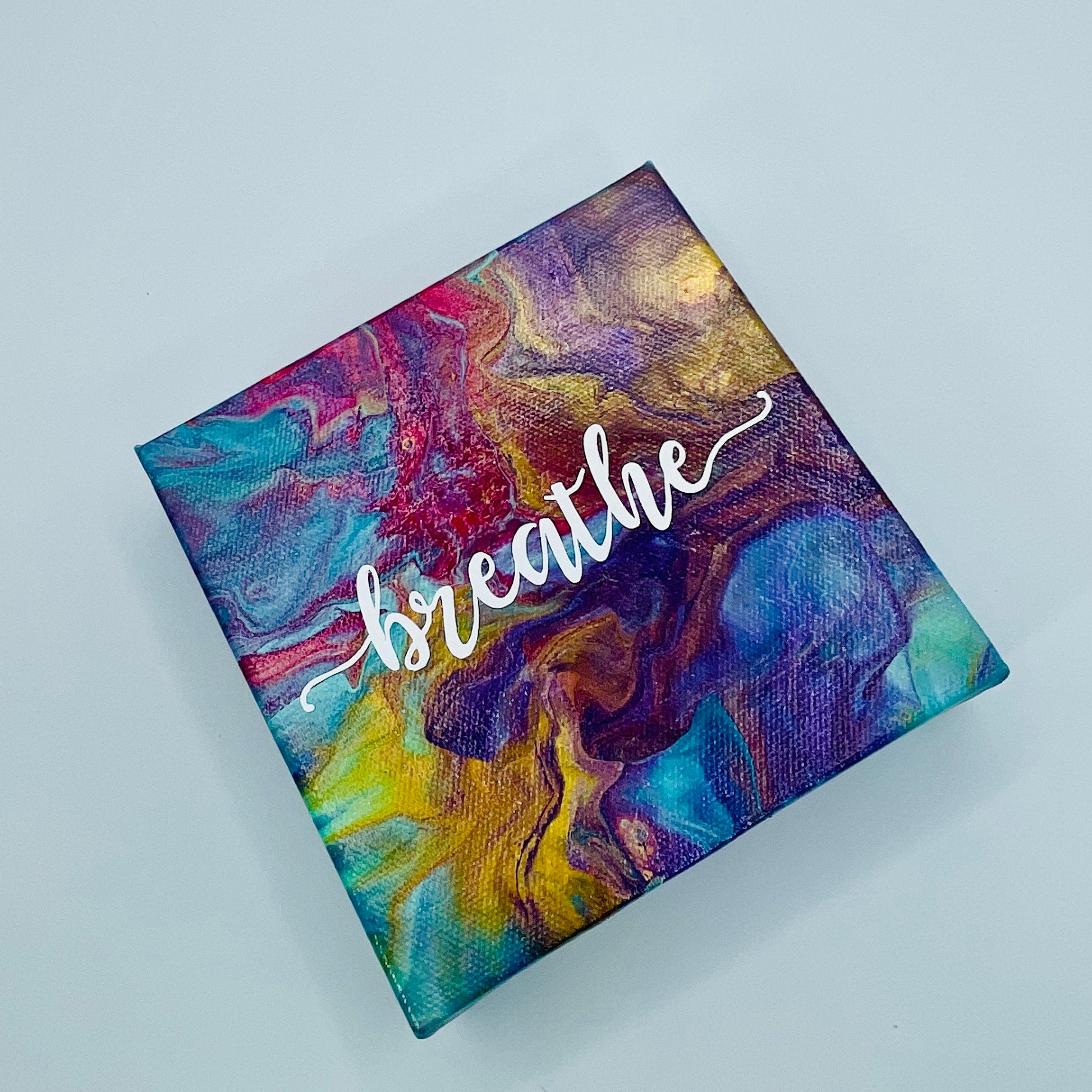 The Sufi Breathe Block. A colorful hand painted painting that says 'breathe'